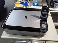 Top view of Canon Pixma MP560 showing overall condition and control panel