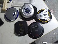 Top view of all five CD players showing brands and controls