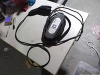 Full view of charging station with cable and connector