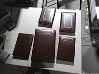 Top view of five brown binders showing size variation