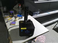 Front and top view of Creality resin 3D printer on table