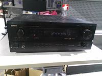 Front view of Denon AVR-3300 receiver powered on