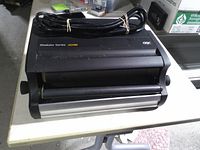 Front view showing GBC Modular Series CC2700 label, dual rollers and attached power cord
