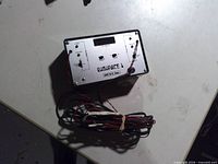Front view showing faceplate, controls, indicator LEDs and attached wiring