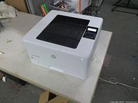Angled view of HP LaserJet Pro 4001dn printer on table