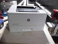 Front view of HP LaserJet Pro M402n printer