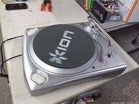 Top view of Ion TTUSB turntable showing slipmat, tonearm, controls, power cord