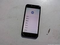 Front view showing setup screen and cracked screen protector