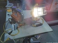 Both work lights side by side, one illuminated