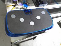 Top view of LifePro vibration plate showing standing surface and pads