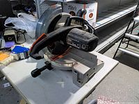Left side overall view showing motor housing, handle, base and lack of dust bag