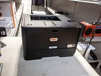 Front and side view of Oki B411d printer
