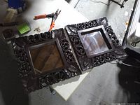 Two carved wooden mirrors front view