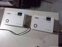 Two QKK projectors top view showing brand and controls