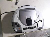 Top view showing CD lid, control buttons, AC cord