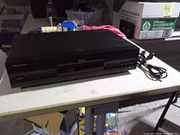 Front view of Pioneer DV-333 DVD player on table