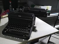 Front and side view of Royal manual typewriter on table