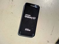 Front view powered on displaying Samsung Galaxy S7 boot screen