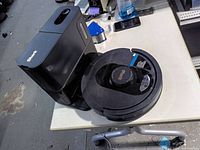 Robot vacuum seated on its charging base