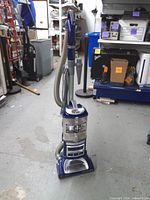 Full view of Shark Navigator Lift-Away Deluxe upright vacuum cleaner with hose and wand