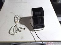 Printer and USB cable on table