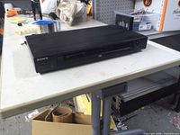 Front view of Sony DVP-NS315 showing tray and controls