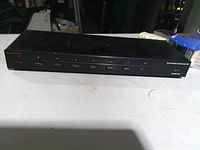 Front view showing eight push buttons and SpeakerCraft branding