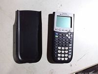 Front view of calculator with cover beside it