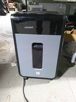 Front view showing full shredder and waste-bin window