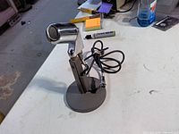 Side view of Electro-Voice 638 microphone on desk stand with cable
