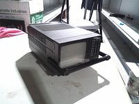 Front and right side view of General Sound portable TV radio showing screen and handle