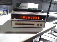 Front view showing LED display lit, front controls and input connector
