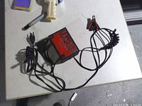 Overall view of charger with cords and clamps