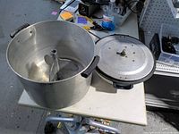 Overall view of washing machine tub, lid, handles, agitator and cord