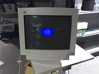 Front view showing screen lit with sync message