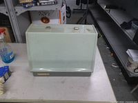 Sewing machine with translucent cover in place