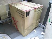 Sealed Xerox Document WorkCentre Pro 657 box on floor, showing main panel