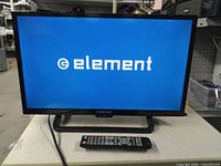 Front view of Element TV powered on showing brand logo