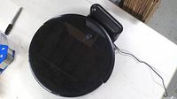 Top view of Eufy RoboVac on charging dock.