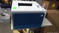 Full view of HP Color LaserJet Pro 4201dn printer on table