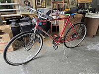 Full left-side view of red Huffy road bicycle