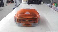 Front view of translucent orange iKTV player
