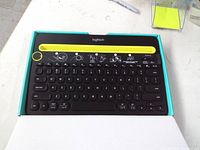 Keyboard in opened box showing cradle and key layout