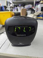 Front view showing LED display, brand and dual alarm icon