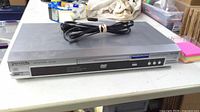 Front view showing Panasonic DVD-S47 player, tray, controls