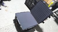 Case open showing egg-crate lid foam and flat foam layer
