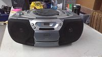 Front view showing Philips boombox with CD player, cassette deck, speakers and controls