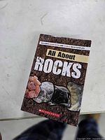 Front cover of Scholastic All About Rocks guide book