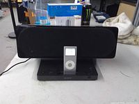 Front view of Sony speaker dock with iPod nano inserted