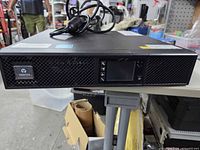 Front view of Vertiv UPS showing LCD and branding